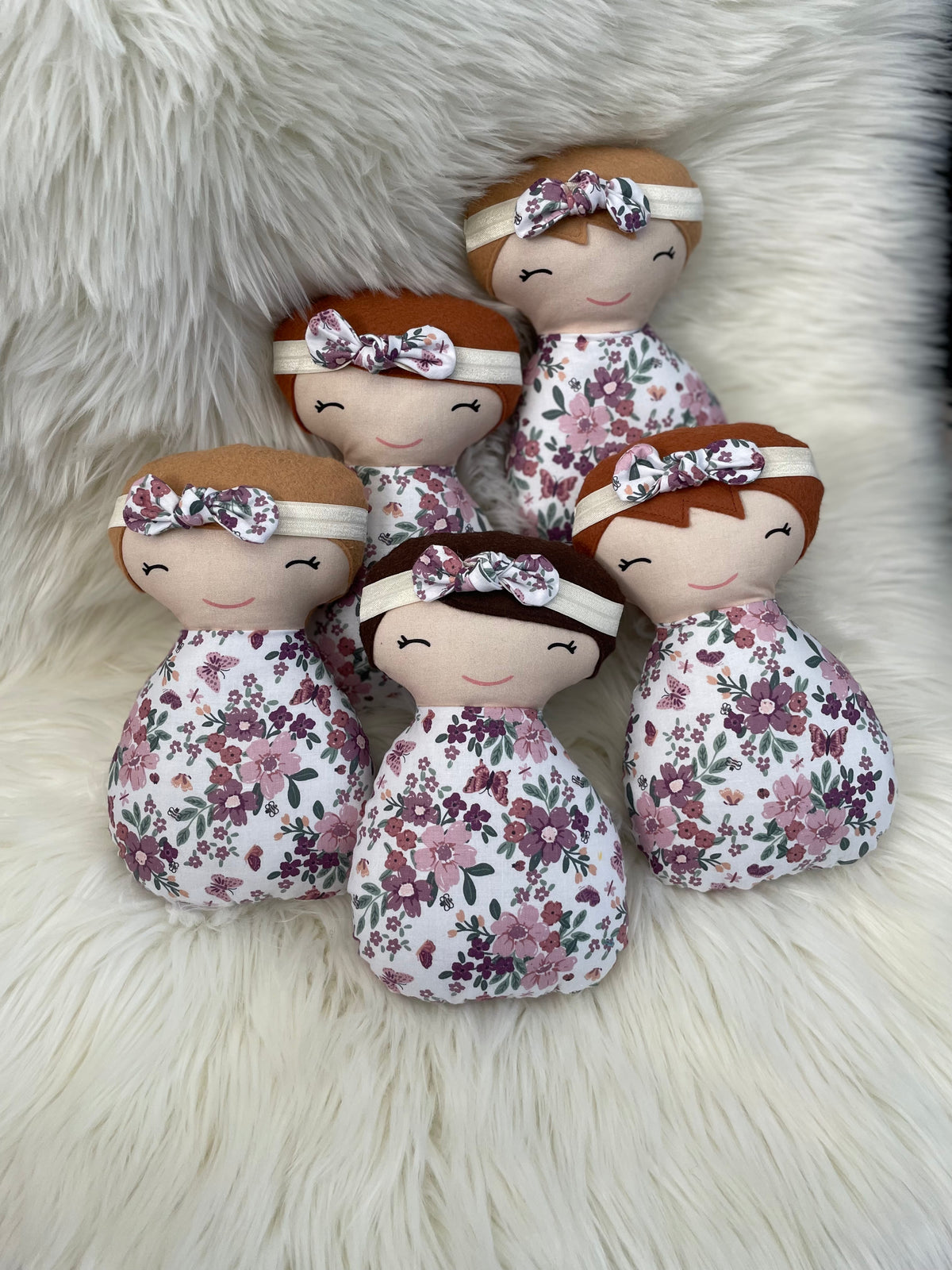 White and Purple Floral Dolls