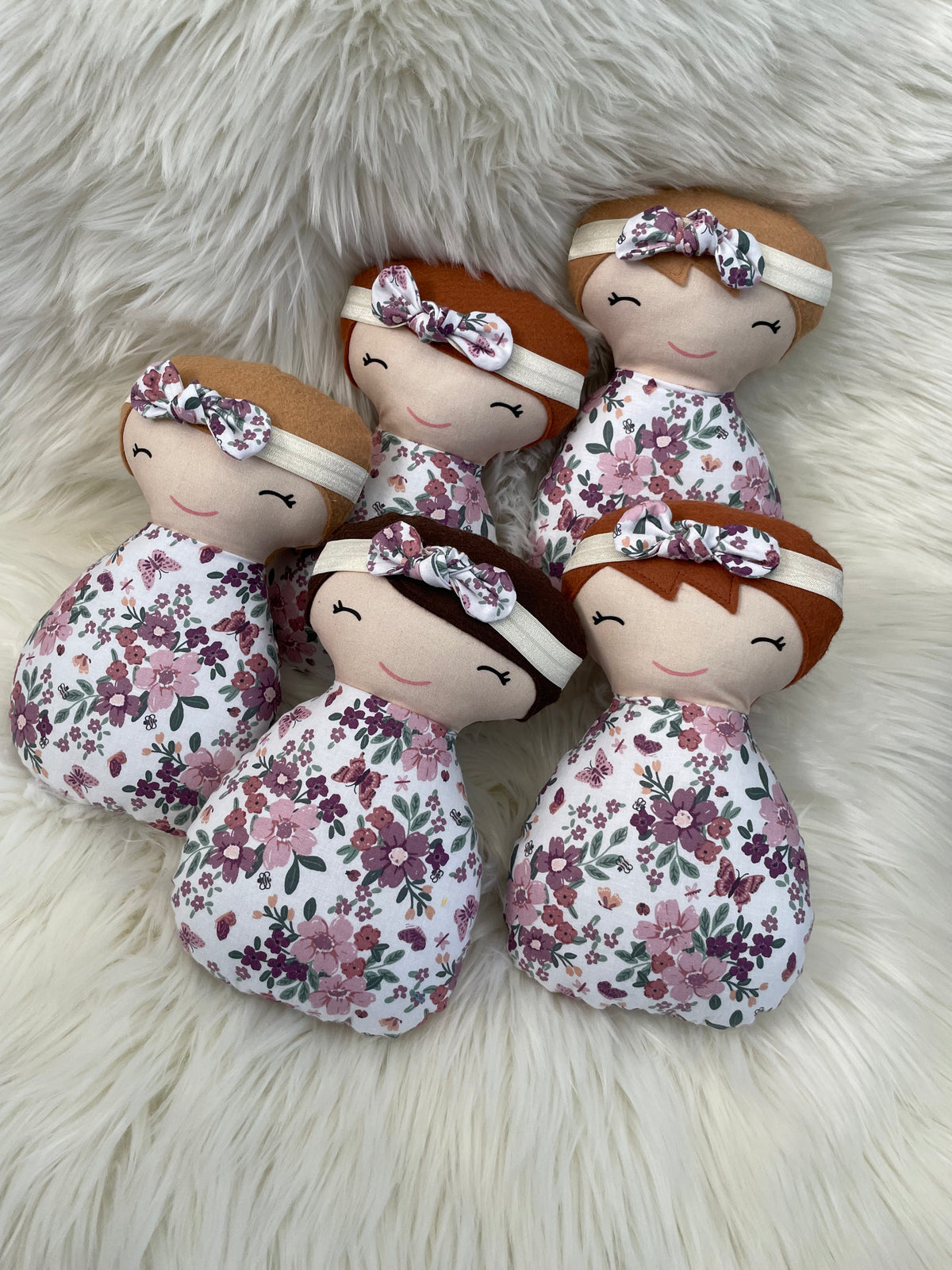 White and Purple Floral Dolls